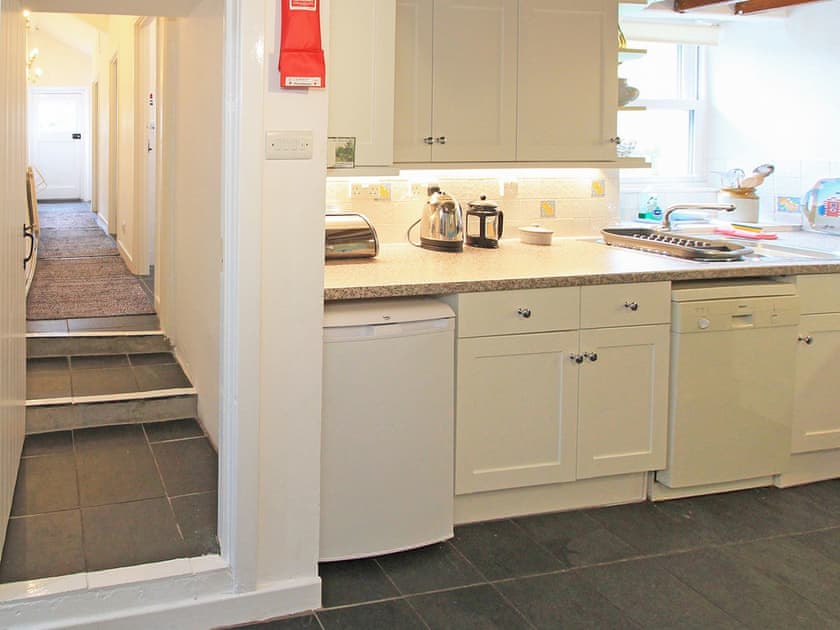 The steps from the Kitchen/diner to the Shower Room, Bathroom, WC Room and the Utility Cupboard  | Former Farmhouse, Llanbedr