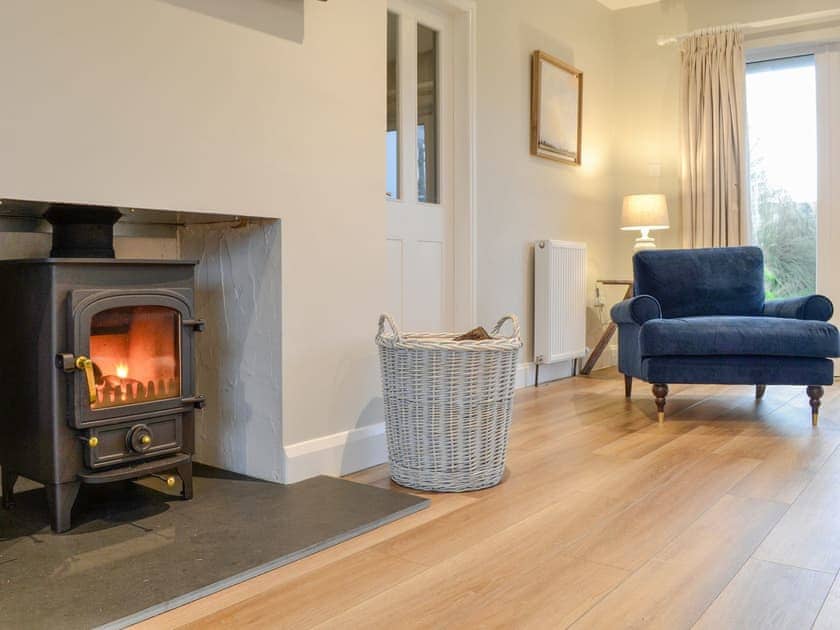 Wood burner within living area | Culbae Cottage, Newton Stewart
