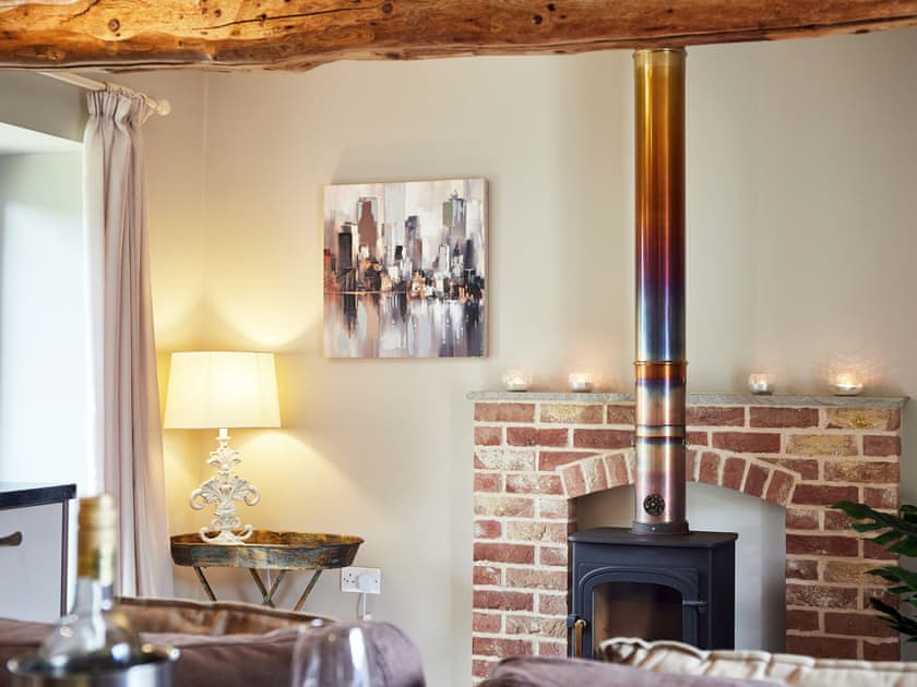 Cosy living area with wood burner | The Old Feedhouse - Manor Mews, Tattersett, near Fakenham
