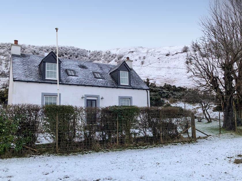 Exterior in winter snow | SQLArran Cottage, Lochranza