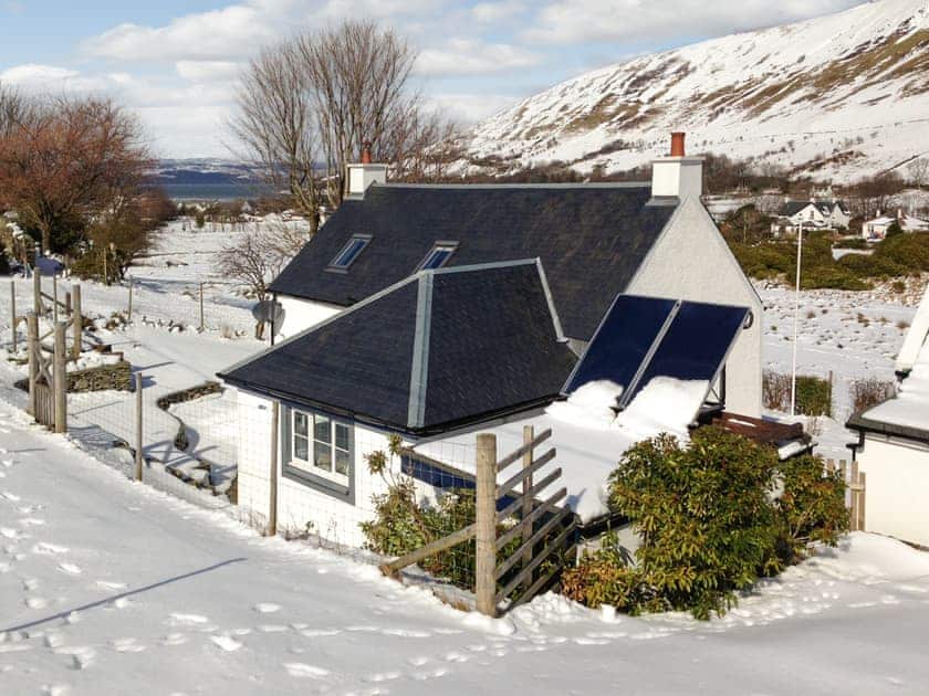 Exterior in winter snow | SQLArran Cottage, Lochranza