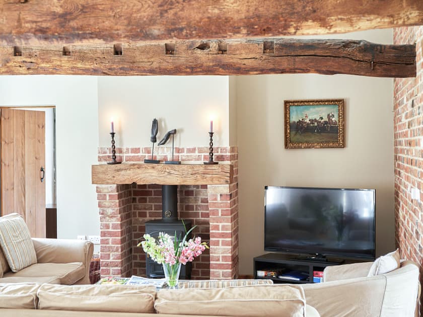Cosy living area with wood burner | The Stables - Manor Mews, Tattersett, near Fakenham