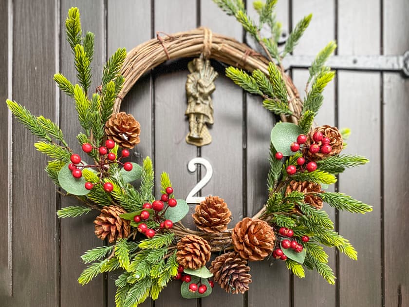 Christmas wreath on the door over the festive period | Holly Cottage, Palnackie, near Castle Douglas