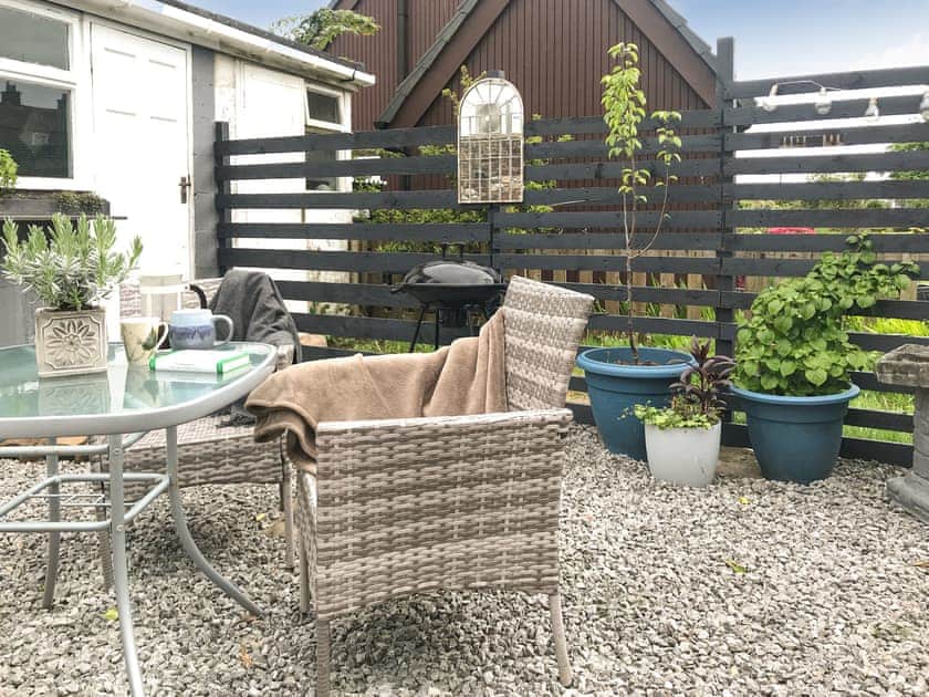 Courtyard style garden with lockable bike store | Mill Cottage, Gosforth