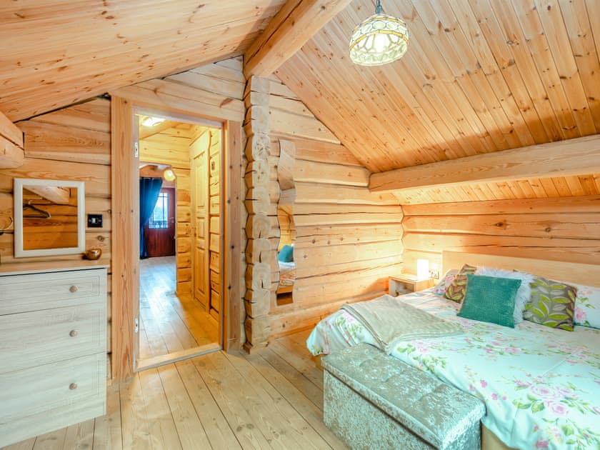 First floor king bedroom | Ty Afal - Dwr Y Felin Log Cabins, Carno