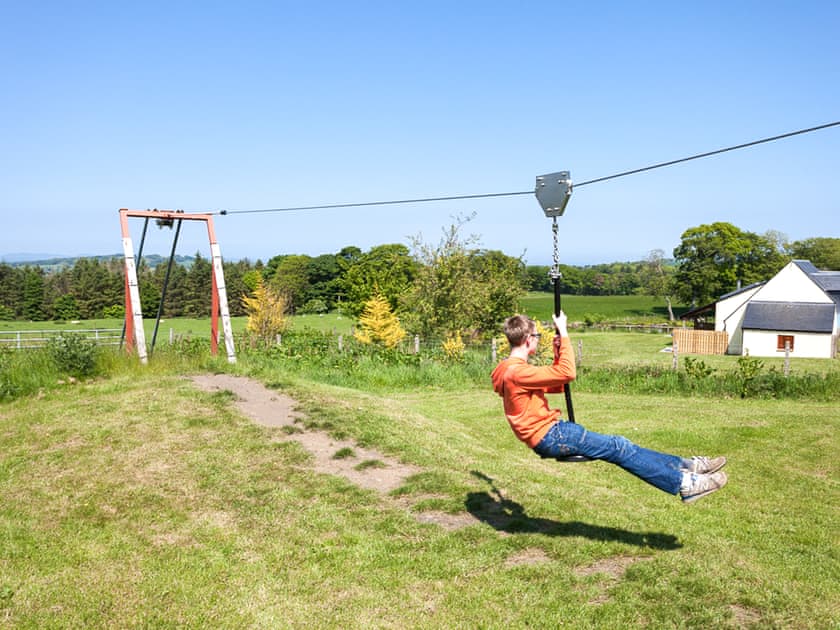 Children’s play area | Beech Cottage - Williamscraig Holiday Cottages, Linlithgow
