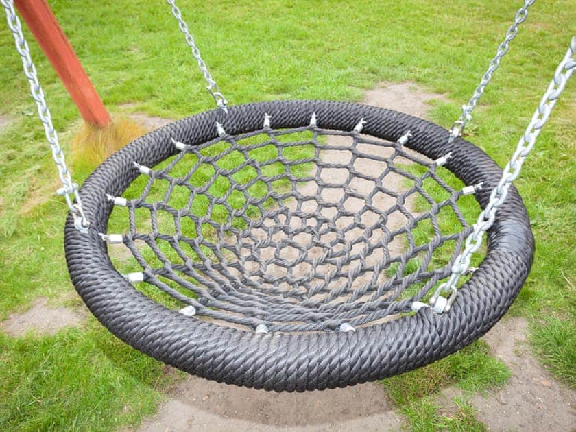 Children’s play area | Beech Cottage - Williamscraig Holiday Cottages, Linlithgow