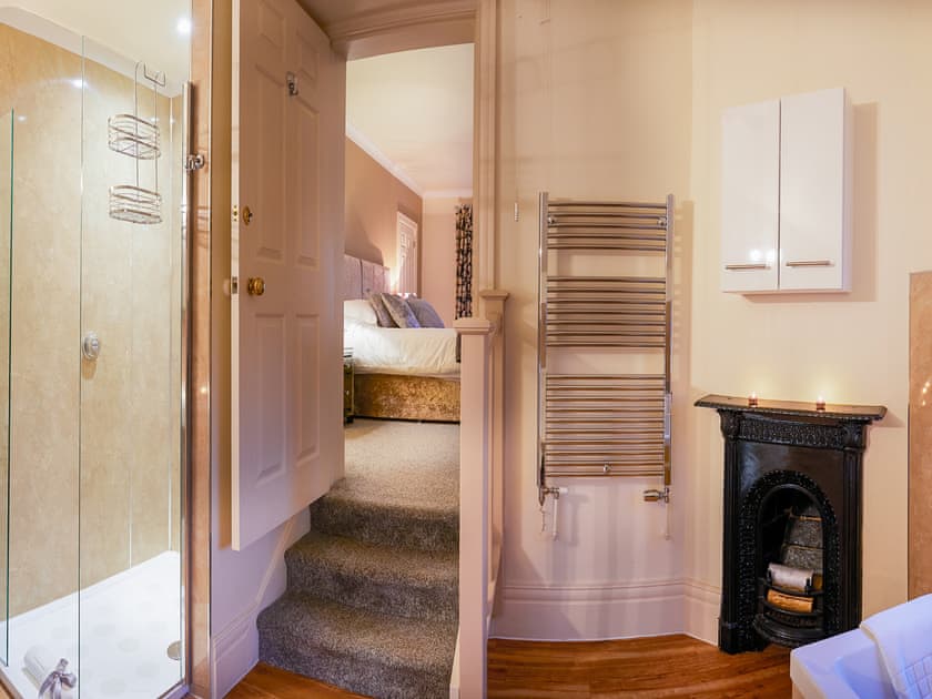 En-suite to the master bedroom with feature fireplace | The Hind House, Cottam, near Driffield