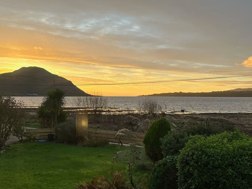 Sunset view over garden | Tides Reach, Lamlash