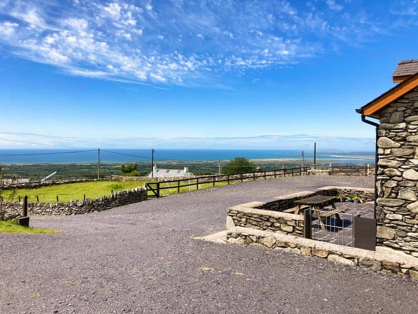 The outlook from the outside of Beudy Bach looking towards Caernarfon Bay and Ireland in the distance | Beudy Bach, Cilgwyn, near Caernarfon