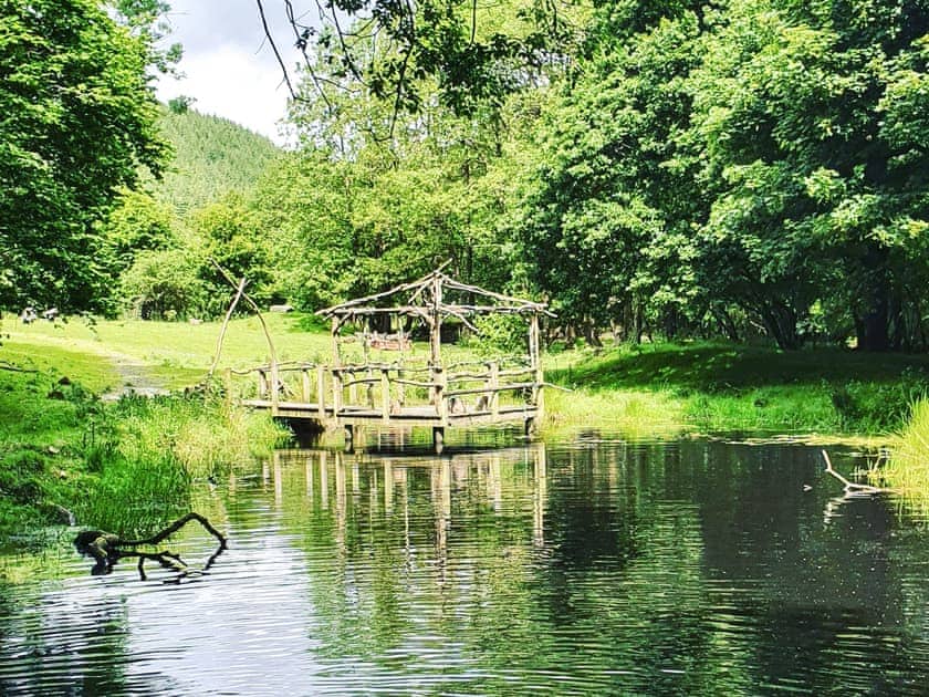 Lover’s Lake with jetty a short stroll away  | Ty Afal - Dwr Y Felin Log Cabins, Carno
