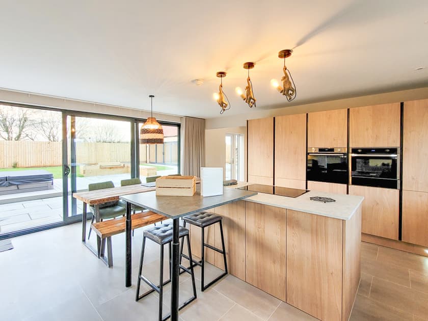 Kitchen island and bifold doors | Lindum Barn - Ashlin Farm Barns, Dunholme, near Lincoln