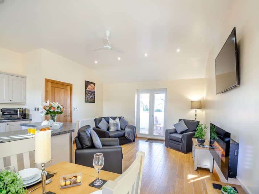 Open plan living space | Pwyll Cottage - Bryn Awel Caravan Park, Pentraeth
