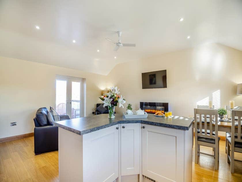 Open plan living space | Pwyll Cottage - Bryn Awel Caravan Park, Pentraeth