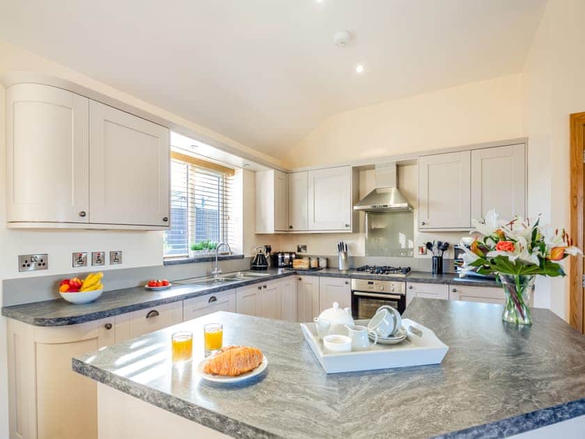 Kitchen area | Pwyll Cottage - Bryn Awel Caravan Park, Pentraeth