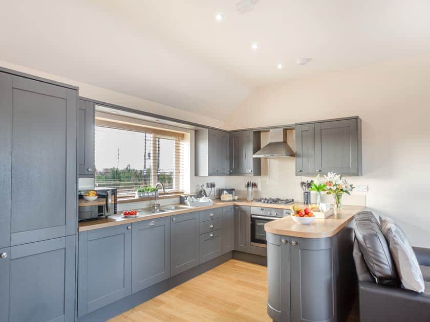 Open plan living space | Manawydan Cottage - Bryn Awel Caravan Park, Pentraeth