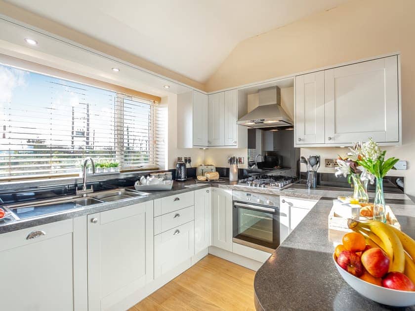 Kitchen area | Math Cottage - Bryn Awel Caravan Park, Pentraeth