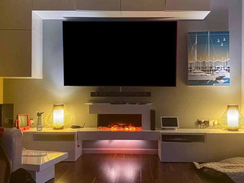 Living room with 65 inches smart TV | Gorsehill House, Poole