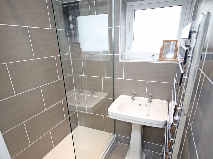 Shower room with only a shower and hand wash basin  | The Moorings Apartment, Porthmadog