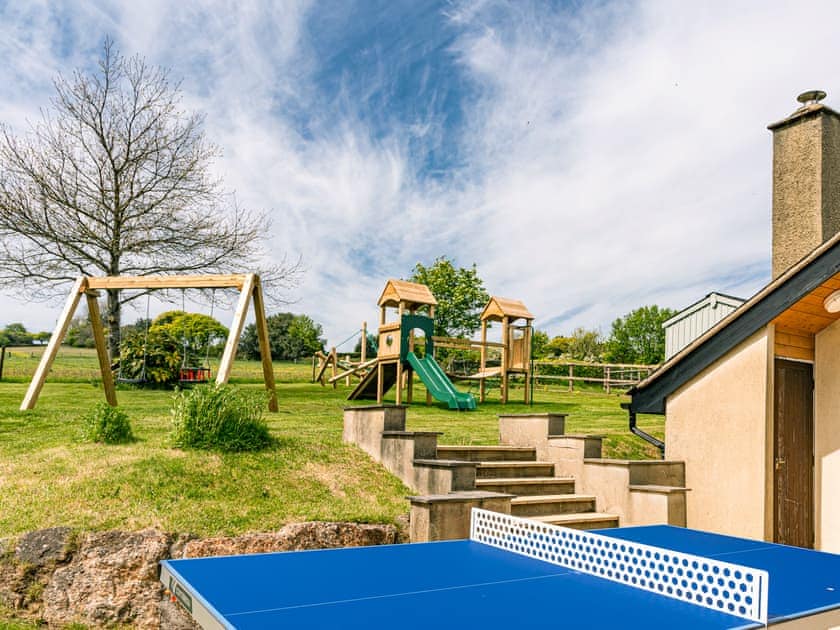 Outdoor recreation area with children’s play equipment | Lower Elsford Farm, Lustleigh, near Bovey Tracey