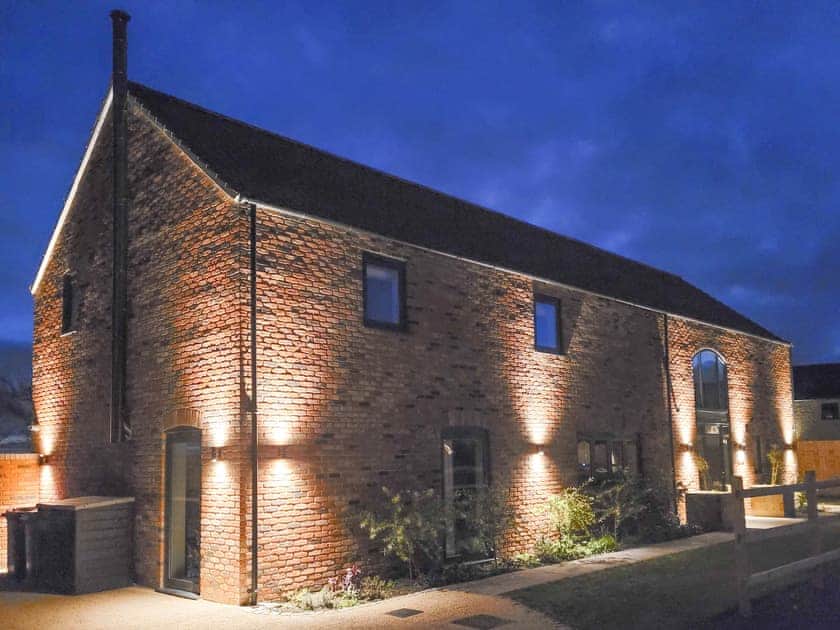 Exterior illumination at night | Chestnut House - Ashlin Farm Barns, Dunholme, near Lincoln
