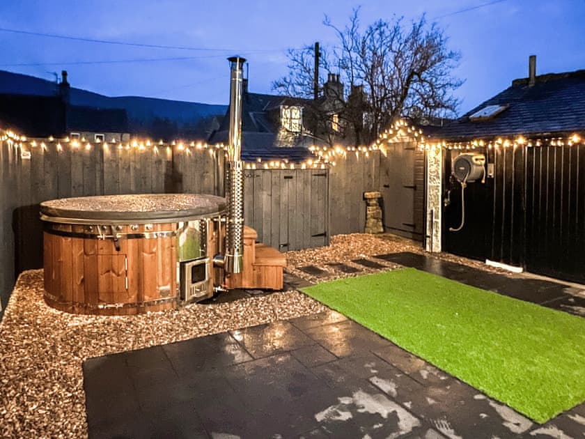 Garden and Hot tub at night | Logiemar Cottage, Ballater