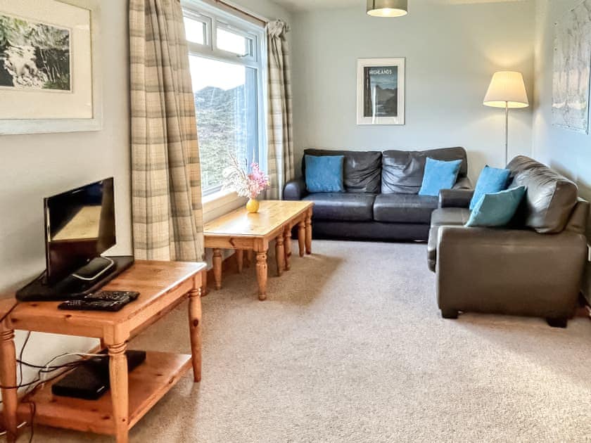 Cosy up and admire the beautiful view | Orchid Cottage - Cathair Dhubh Estate, Clachtoll, near Lochinver