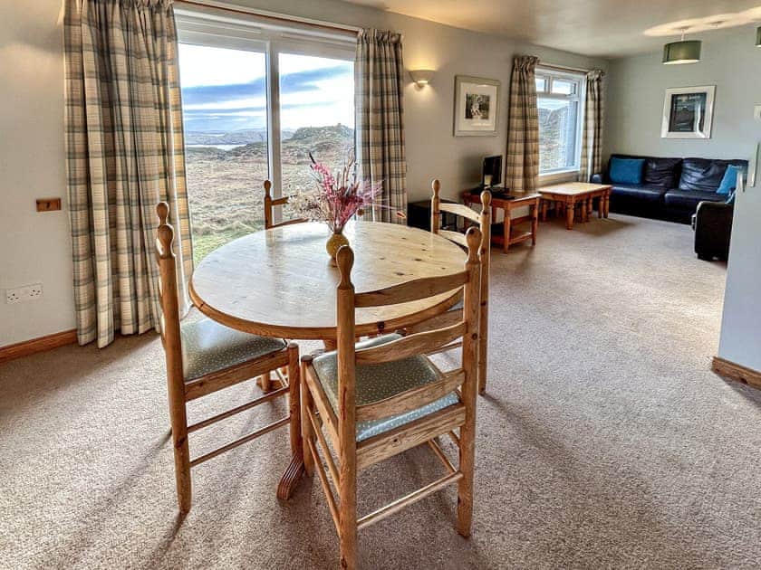 Bright and spacious living/dining area with amazing views from every window | Orchid Cottage - Cathair Dhubh Estate, Clachtoll, near Lochinver