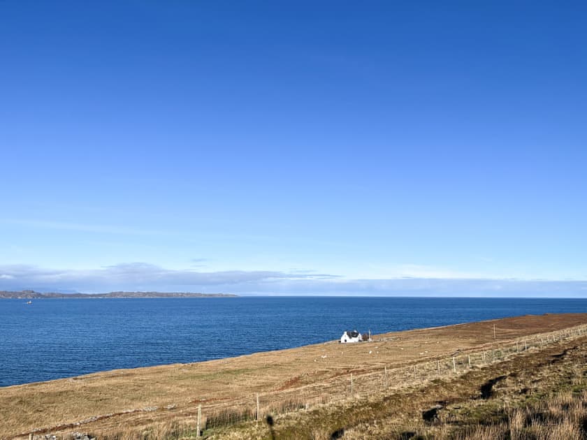 The Old Schoolhouse from the road with views of the Inner Hebrides | The Old School House, Applecross