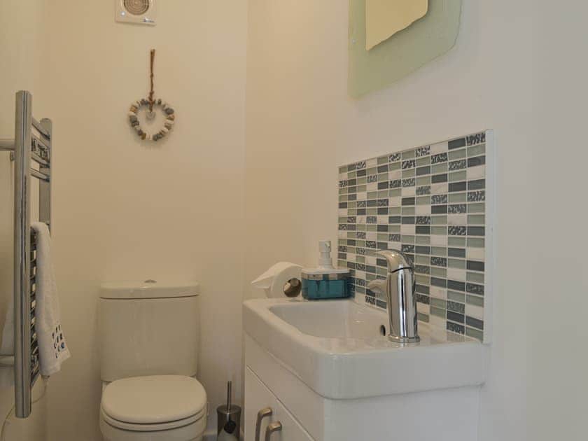 Separate toilet with heated towel rail | The Holiday House, Benllech