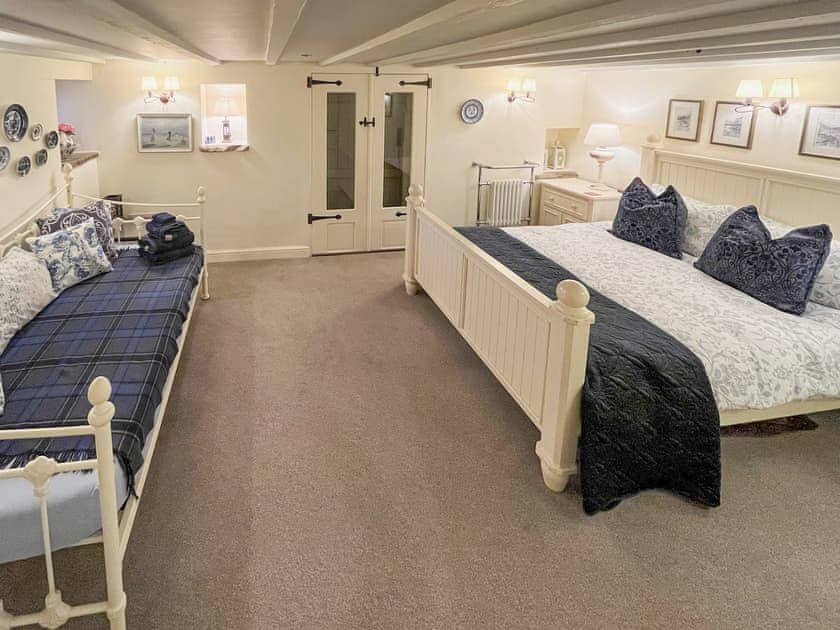 Master bedroom with a double and a single bed | The Barn at Woodland View, Barlow, near Chesterfield