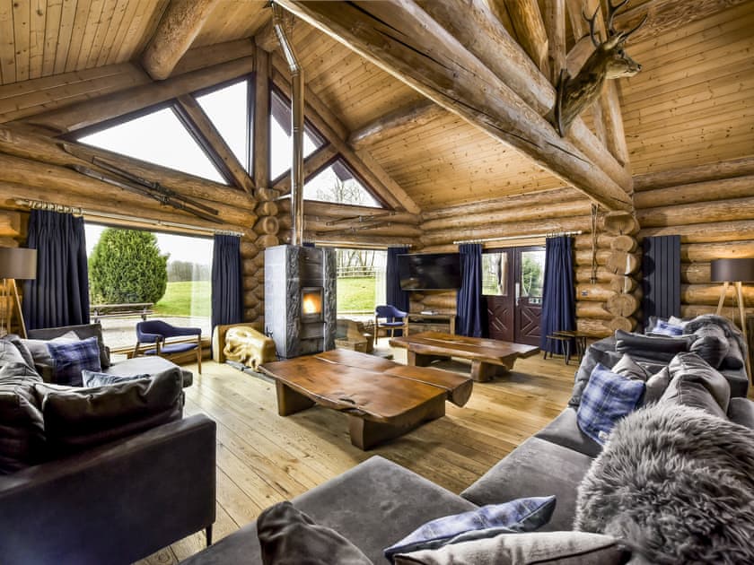 The lounge with wood burning fire | Mountain Bear Lodge, Nethy Bridge, near Aviemore