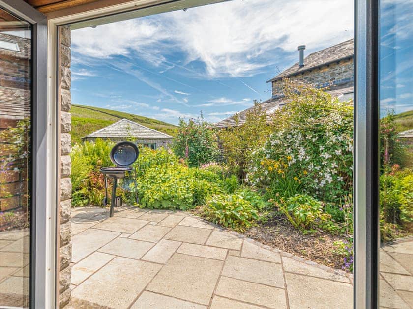 Patio | Sandbeds Farmhouse - Sandbeds Holiday Cottages, Grayrigg, near Kendal