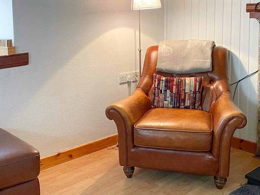 Comfy fireside chair, perfect for relaxing with your favourite book  | Riverside Cottage, Drumnadrochit, near Loch Ness