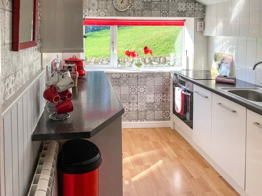 Charming kitchen overlooking the garden | Balnowlart Lodge, Ballantrae, near Girvan