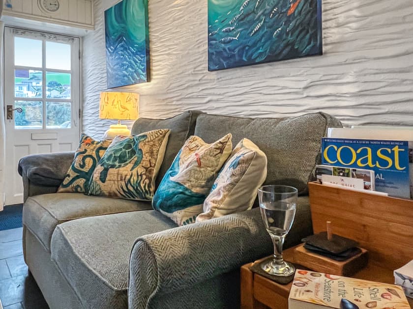 Living room sofa and paintings | Puffin Burrow, Portmellon, near Mevagissey