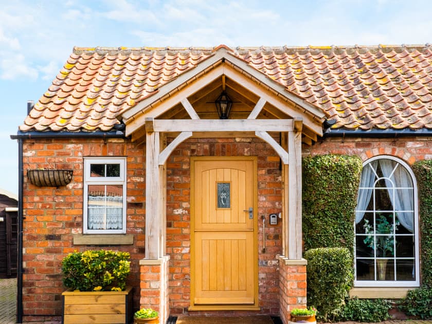 Cottage frontage, guests parking alongside | The Old Post Office, Thorpe Bassett, near Malton