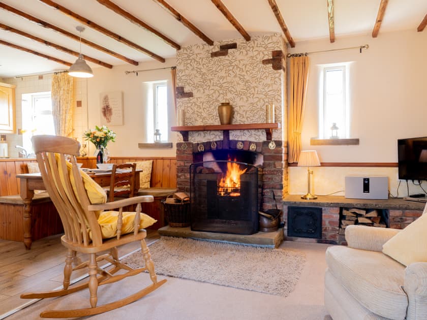 Enjoy a glass of wine by the open fire | The Old Post Office, Thorpe Bassett, near Malton