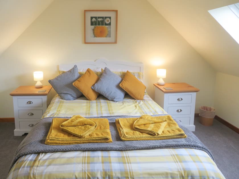 Relaxing en-suite double bedroom | Breacwell Cottage, Migdale, near Dornoch
