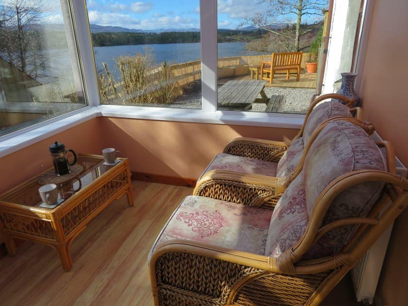 Stunning view over Loch Migdale from the conservatory | Breacwell Cottage, Migdale, near Dornoch