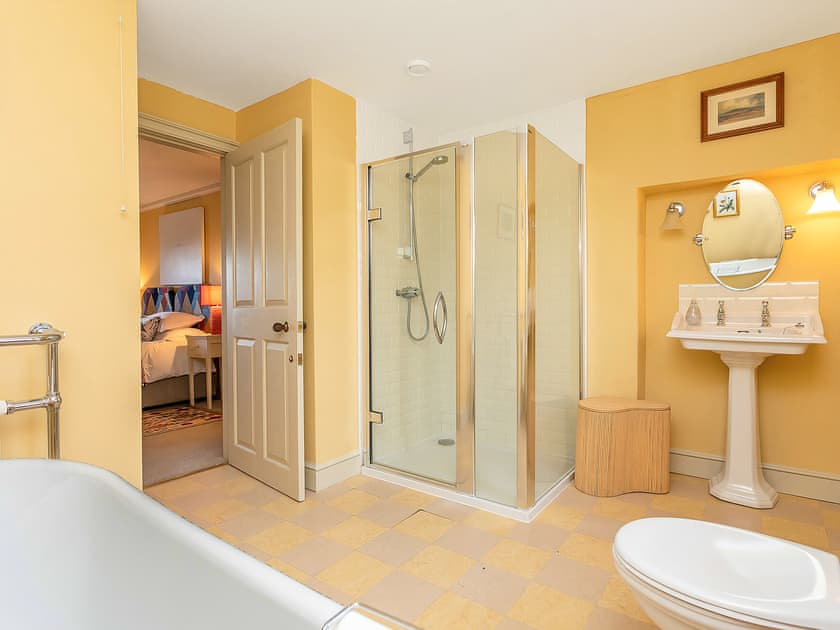 En-suite bathroom with shower cubicle and free standing bath | Yellison - Broughton Hall Estate, Broughton, near Skipton