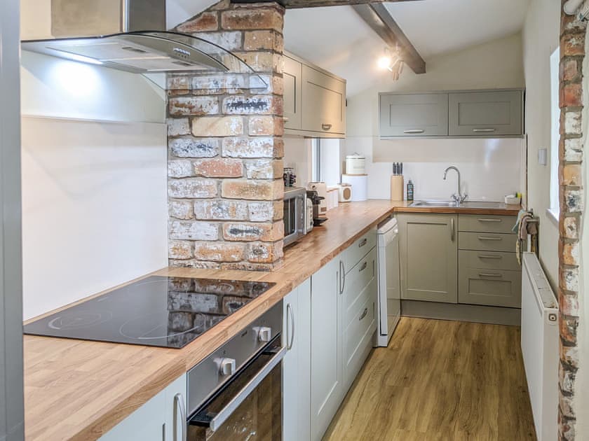 Well appointed galley style kitchen  | Seascape Cottage, Allonby, near Maryport