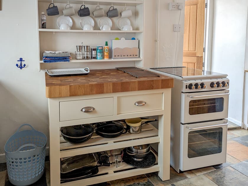 Kitchen with butcher block island | Trinity Cottage, Wells-next-the-Sea