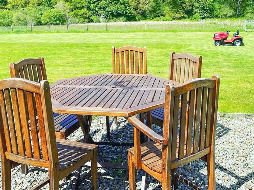 Large well maintained enclosed garden stretching over the small river at the top of the garden with wonderful rural views. The garden features oak table and chairs and BBQ available for use  | Kirnan Cottage, Kilmichael Glassary, near Lochgilphead