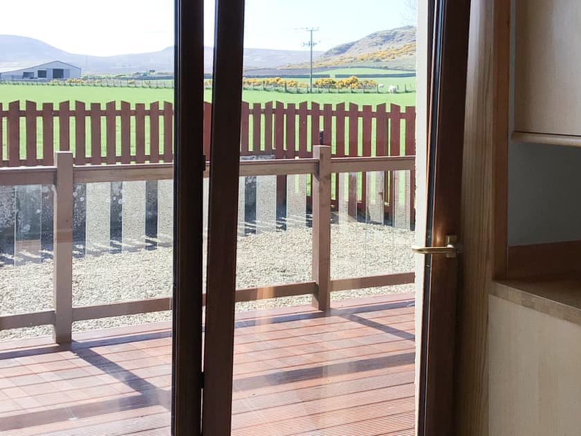 Kitchen patio doors leading to decking | Stackyard Cottage, Reay, near Thurso