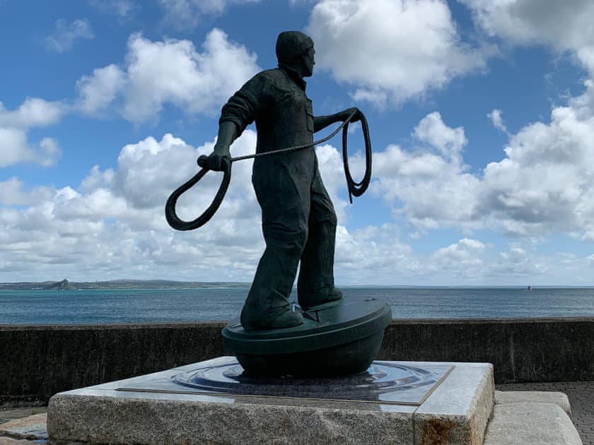 Newlyn fishermen statue at the start of the boardwalk and just around the corner from the cottage | The Basket Loft, Newlyn