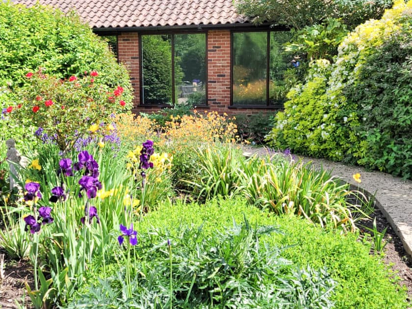 View from swimming pool. | Riverside Cottage, Old Costessey