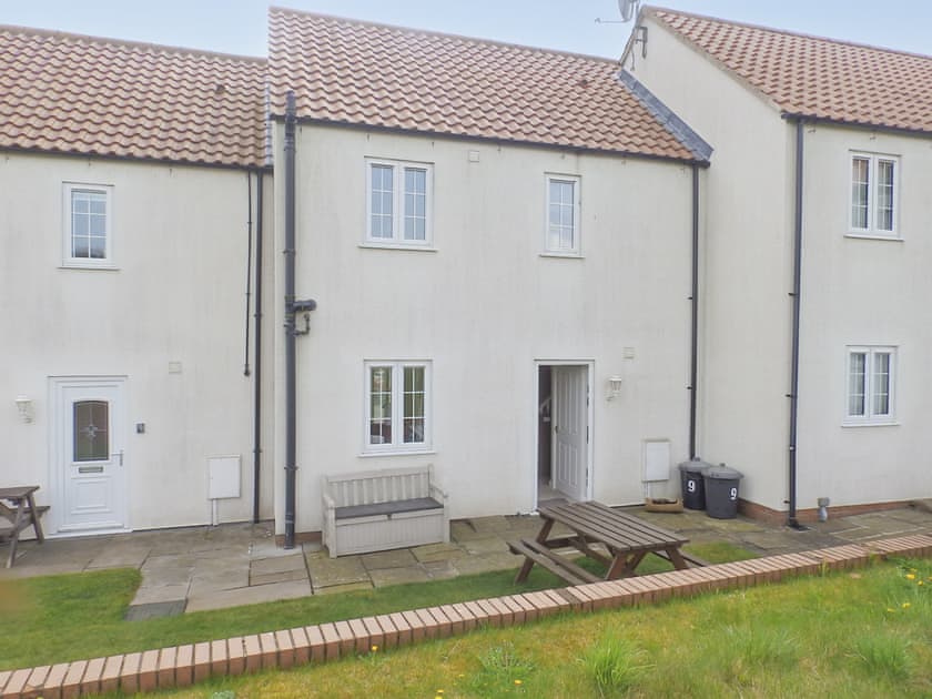 Rear sit out amenity space with grassed area | Meadow View, Bridlington