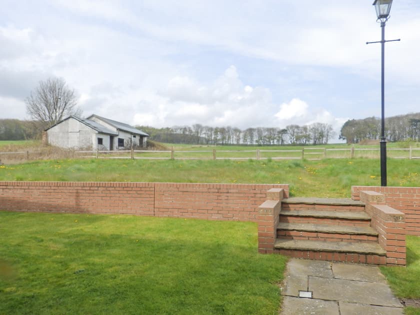 View from communal parking to rear meadow space. | Meadow View, Bridlington