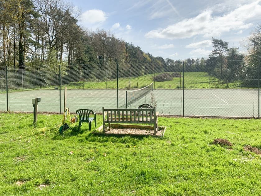 Shared Tennis Court. Please bring your own tennis rackets and balls. 180m from Orchard House | Orchard House, Hempstead, near Holt